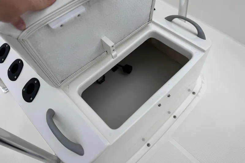 Slide: The Image of Open storage compartment on 2017 Bayliner Element F18 boat. - 14