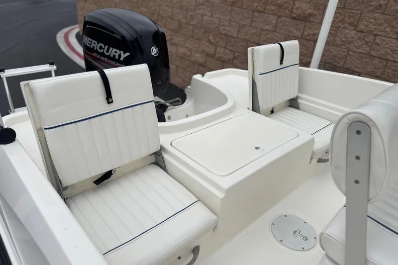 Slide: The Image of 2017 Bayliner Element F18 boat interior with Mercury outboard motor. - 17