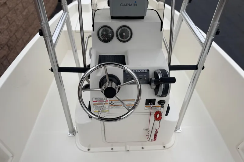 Slide: The Image of 2017 Bayliner Element F18 boat console with steering wheel and Garmin navigation system. - 22