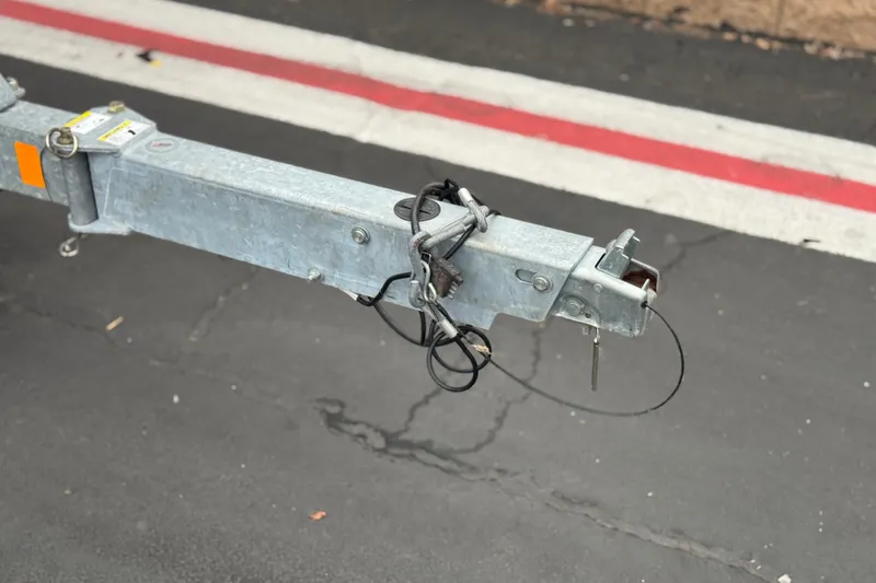 Slide: The Image of Trailer hitch of a 2017 Bayliner Element F18 on asphalt pavement. - 27