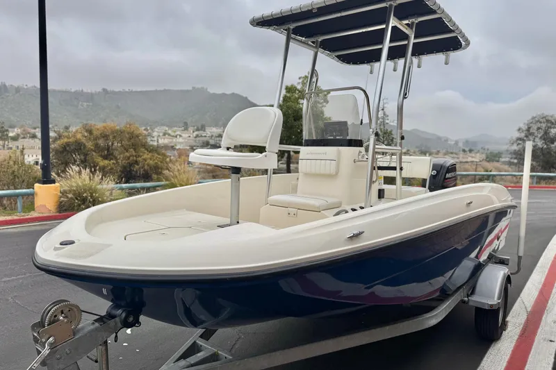 Slide: The Image of 2017 Bayliner Element F18 boat on trailer, scenic background, overcast sky. - 3