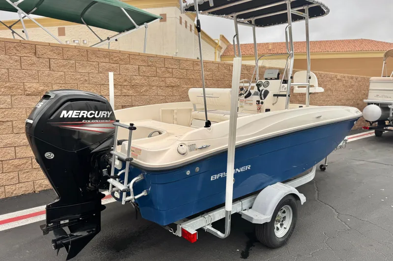 Slide: The Image of 2017 Bayliner Element F18 boat with Mercury outboard motor on trailer. - 5