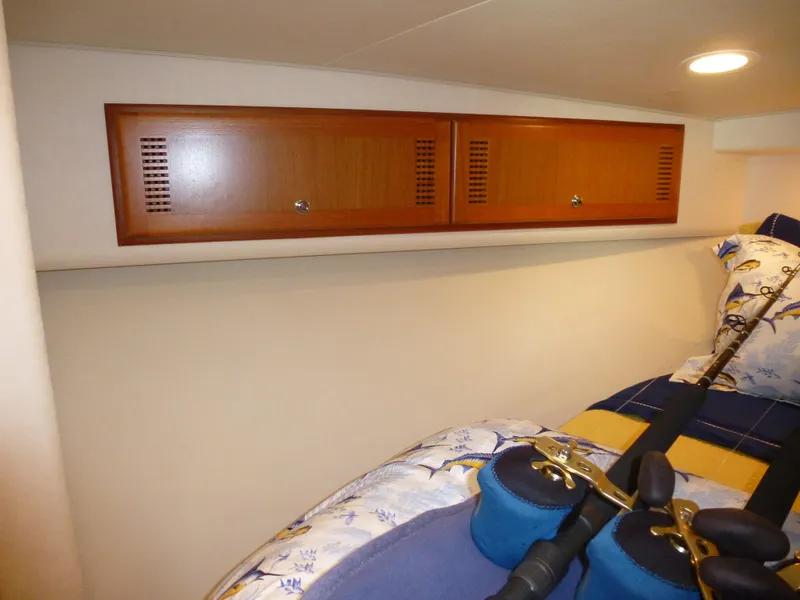 Slide: The Image of 2005 Cabo 40 Express yacht interior with ocean view and bridge in background. - 10