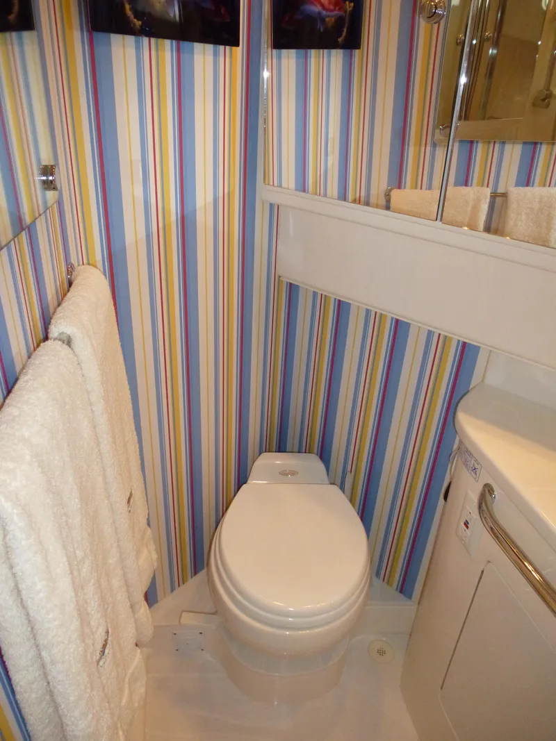 Slide: The Image of 2005 Cabo 40 Express interior with portable cooler and speaker. - 14