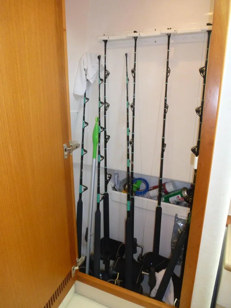 Slide: The Image of Portable cooler on 2005 Cabo 40 Express boat interior, next to white seating. - 15