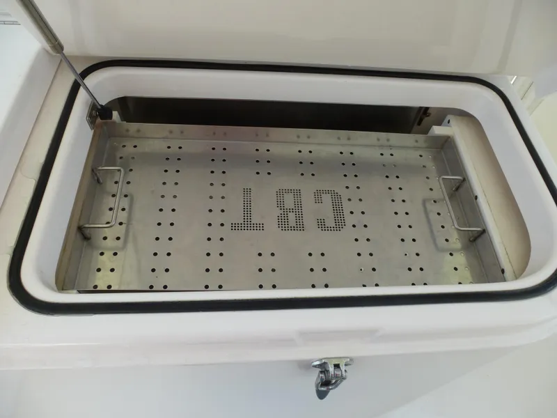 Slide: The Image of 2005 Cabo 40 Express boat deck under clear blue sky. - 19