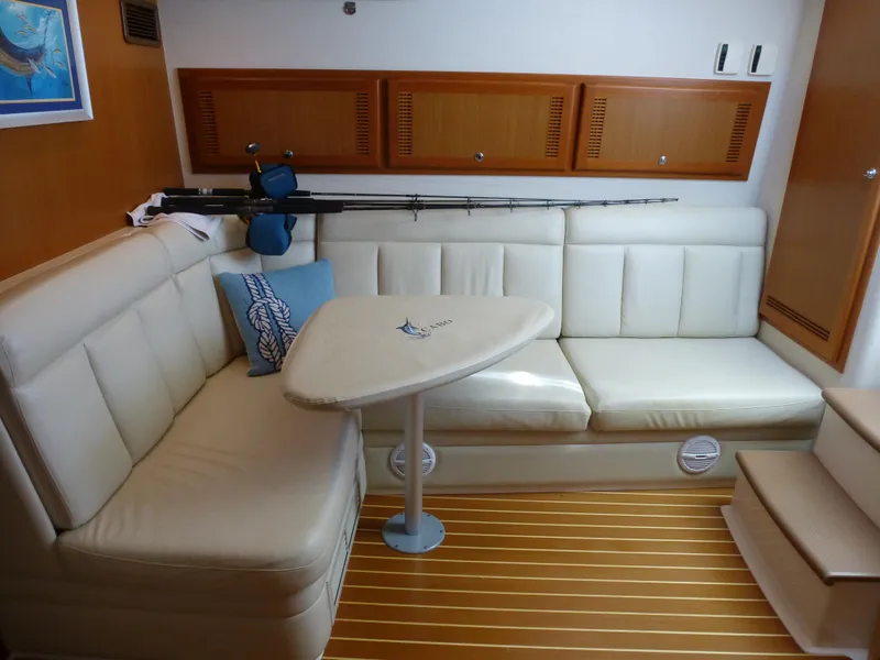 Slide: The Image of Luxurious interior of 2005 Cabo 40 Express yacht with modern kitchen and cozy seating area. - 2