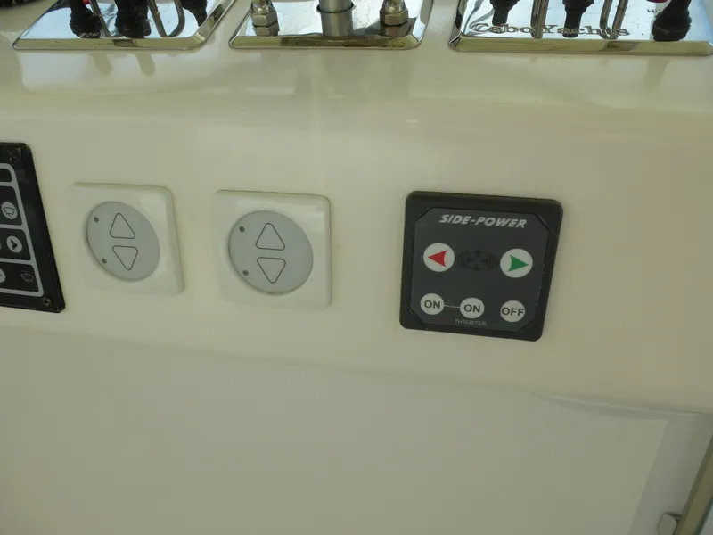 Slide: The Image of 2005 Cabo 40 Express yacht with sleek design on open water. - 27