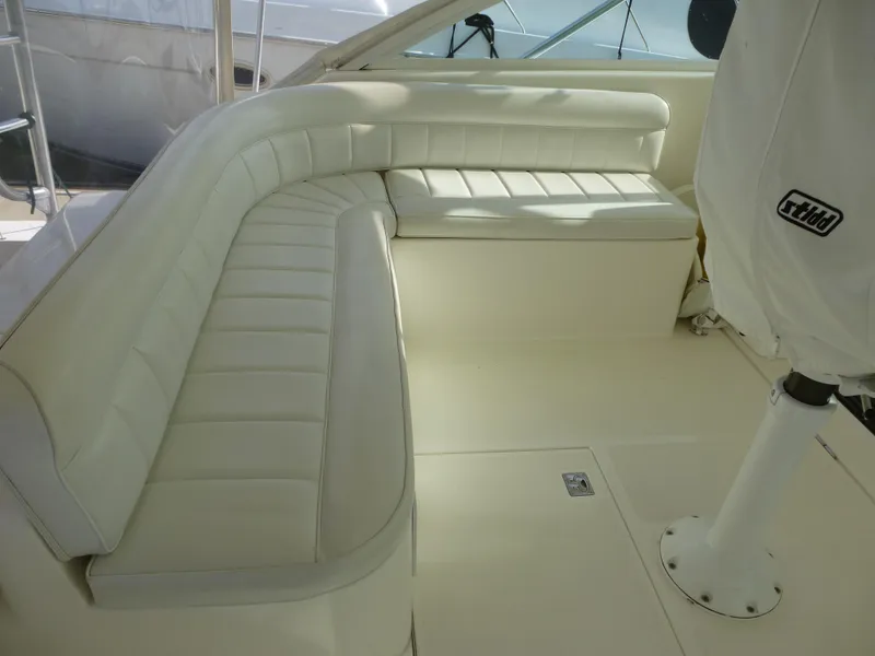 Slide: The Image of 2005 Cabo 40 Express yacht with spacious deck and ocean view. - 28