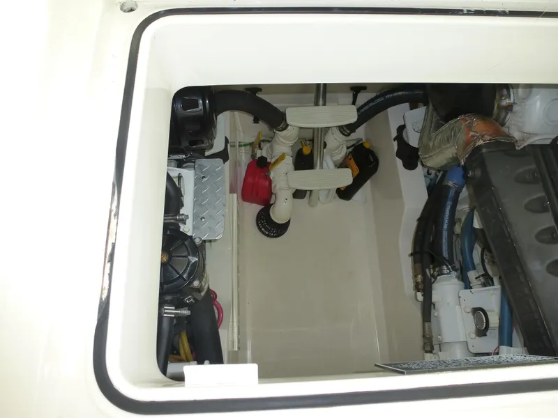 Slide: The Image of 2005 Cabo 40 Express yacht with spacious deck and clear blue sky backdrop. - 29