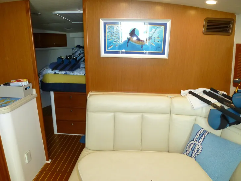 Slide: The Image of Luxurious cabin interior of 2005 Cabo 40 Express yacht with cozy bed and wooden cabinetry. - 3