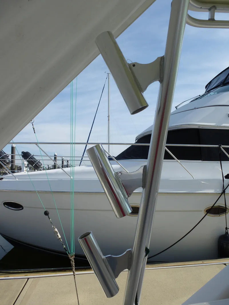 Slide: The Image of Helm of 2005 Cabo 40 Express boat with ocean view and American flag. - 30