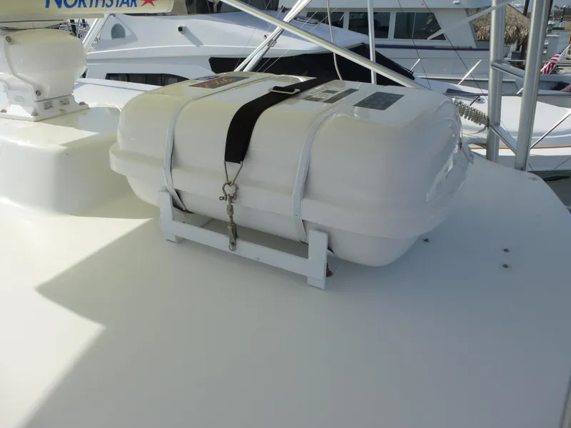 Slide: The Image of 2005 Cabo 40 Express yacht helm with ocean view and clear blue sky. - 31