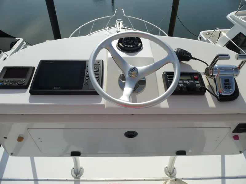 Slide: The Image of Navigation system on 2005 Cabo 40 Express boat dashboard with digital displays. - 36