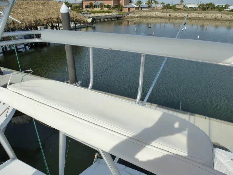 Slide: The Image of Helm of 2005 Cabo 40 Express yacht with navigation screens and steering wheel. - 37