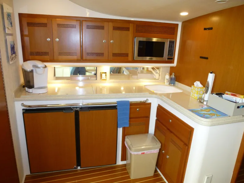 Slide: The Image of Helm of 2005 Cabo 40 Express boat with navigation screens and ocean view. - 5