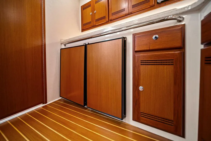 Slide: The Image of 2005 Cabo 40 Express interior with wooden cabinets and flooring. - 51