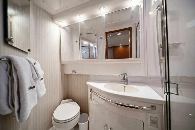 Slide: The Image of Luxurious 2005 Cabo 40 Express yacht bathroom with modern fixtures and elegant design. - 55