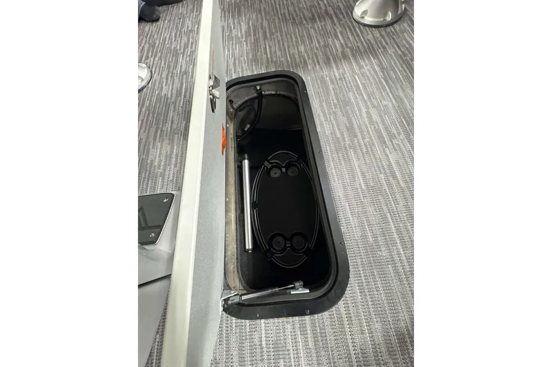 Slide: The Image of Open storage compartment in Viaggio x22u 2026 boat, featuring sleek interior design. - 19