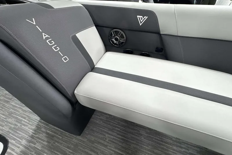 Slide: The Image of 2026 Viaggio x22u boat interior with gray and white seating, speaker, and logo detailing. - 22
