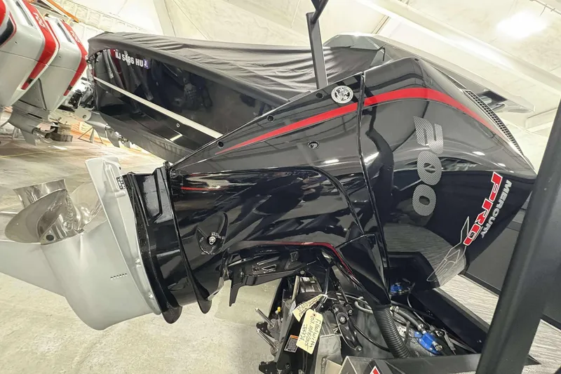 Slide: The Image of 2026 Viaggio x22u boat engine, black with red accents, in a storage facility. - 31