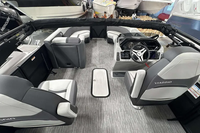 Slide: The Image of 2026 Viaggio x22u boat interior with modern seating and steering console. - 9