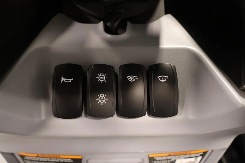 Slide: The Image of Close-up of 2024 Sea-Doo Switch 19 handlebar with control buttons. - 21