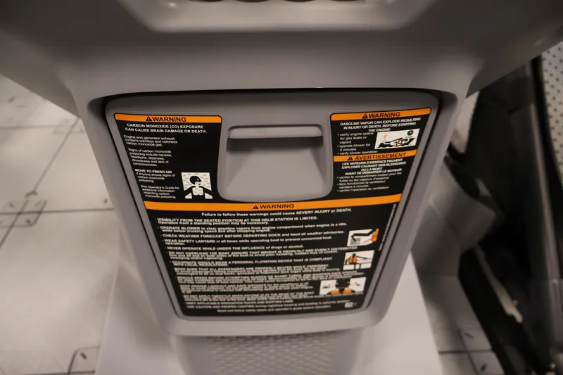 Slide: The Image of 2024 Sea-Doo Switch 19 warning labels on dashboard, emphasizing safety instructions. - 22