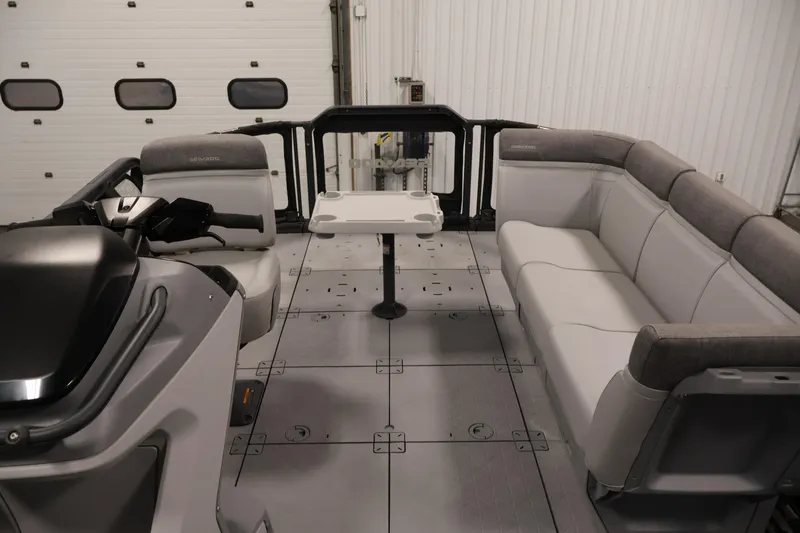 Slide: The Image of 2024 Sea-Doo Switch 19 interior with a central table featuring cup holders. - 24