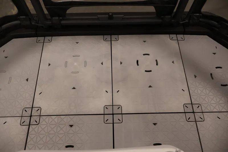 Slide: The Image of 2024 Sea-Doo Switch 19 pontoon boat, side view, sleek design, red and white accents. - 33