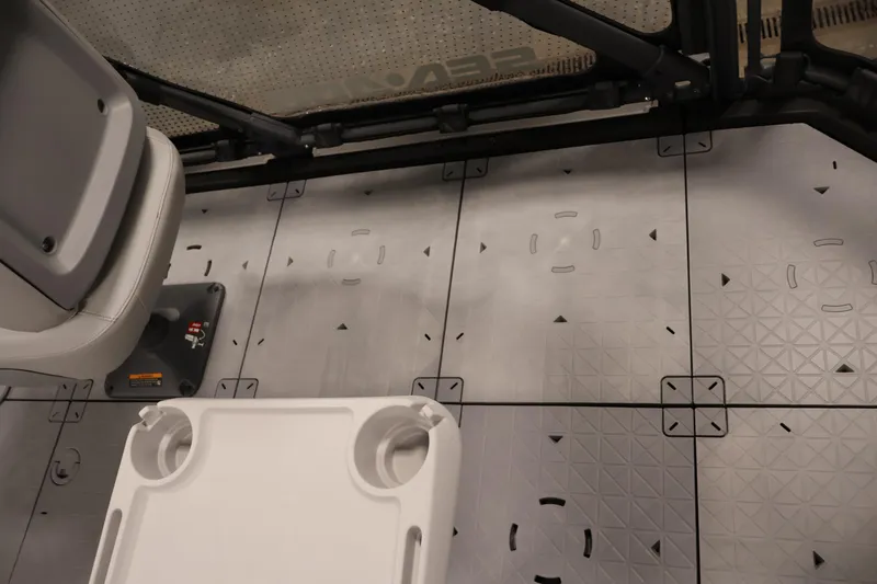 Slide: The Image of 2024 Sea-Doo Switch 19 interior with modular seating and textured flooring. - 34
