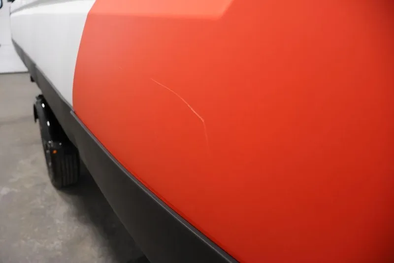 Slide: The Image of 2024 Sea-Doo Switch 19 close-up, showcasing red and white exterior with a visible scratch. - 37