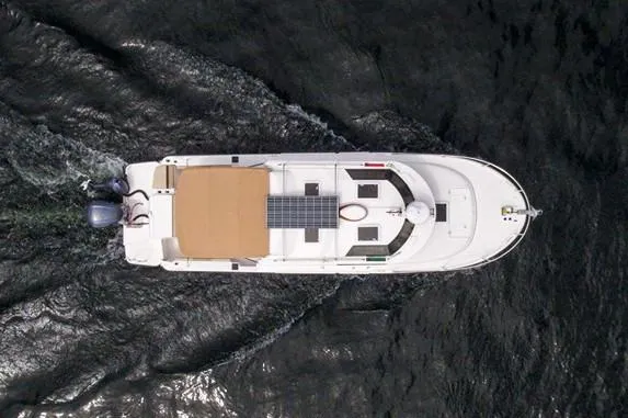 Slide: The Image of Manufacturer Provided Image: Aerial view of 2025 Ranger Tugs R-27 boat with solar panels on water. - 7