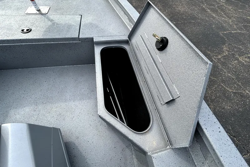 Slide: The Image of Open storage compartment on 2025 Xpress H20B Bay boat deck. - 21