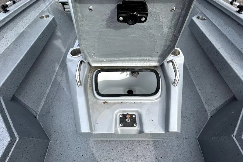 Slide: The Image of Open storage compartment on 2025 Xpress H20B Bay boat, showcasing interior design. - 26