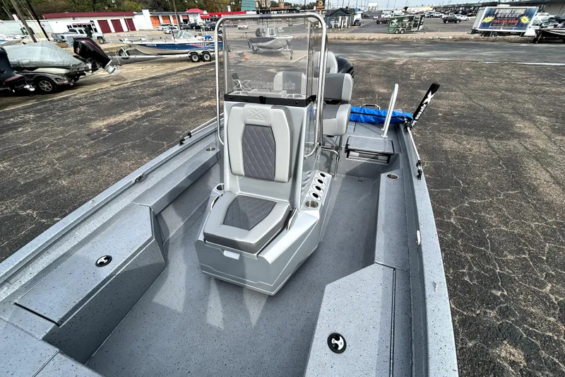 Slide: The Image of 2025 Xpress H20B Bay boat with sleek gray interior and modern design. - 27