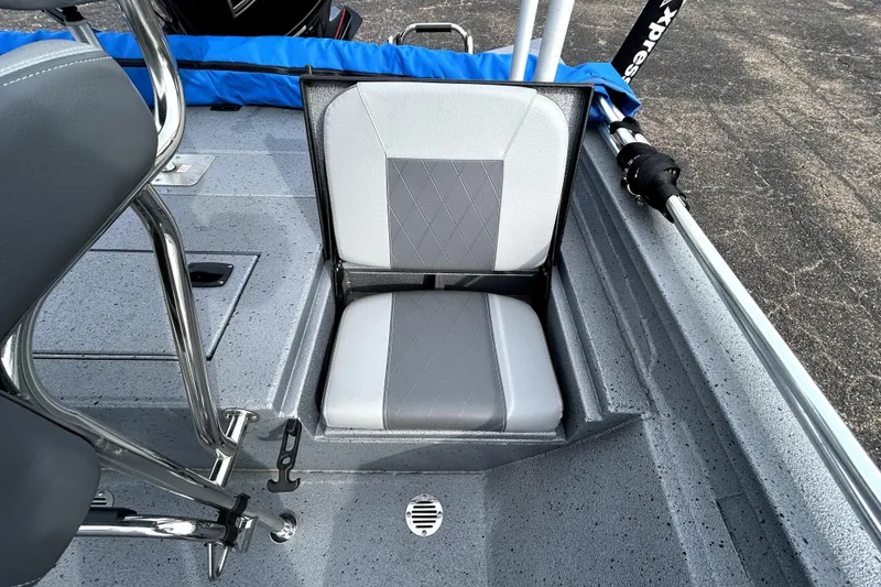 Slide: The Image of 2025 Xpress H20B Bay boat seat with gray upholstery and storage compartment. - 35