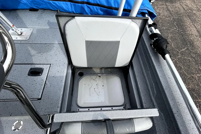 Slide: The Image of 2025 Xpress H20B Bay boat seat with storage compartment, gray and white design. - 36