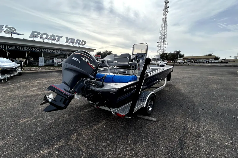 Slide: The Image of 2025 Xpress H20B Bay boat with Yamaha engine at dealership lot. - 9