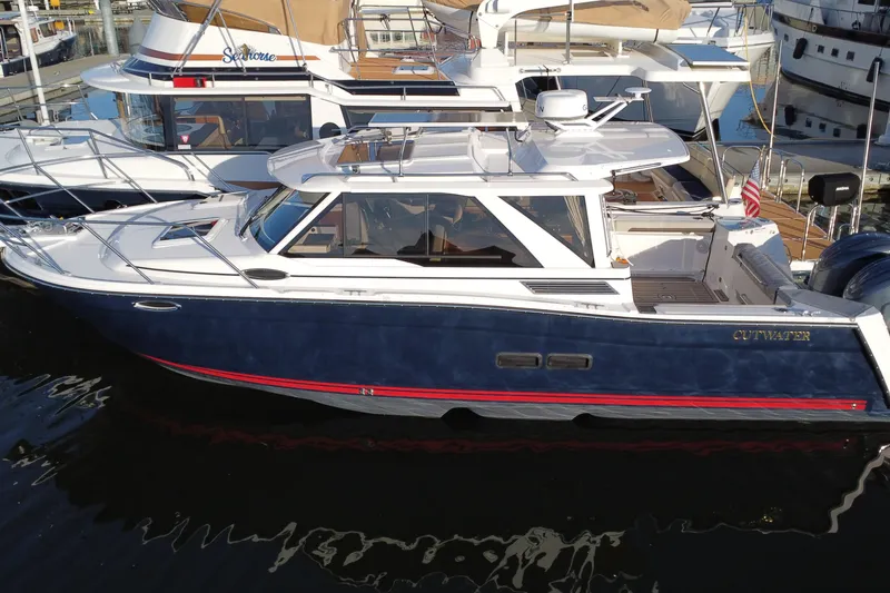 The Image of 2025 Cutwater C-288 Coupe boat docked, featuring sleek design and modern amenities. - 0