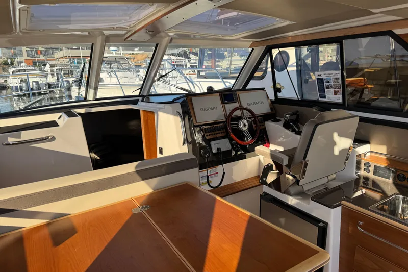 Slide: The Image of Interior of 2025 Cutwater C-288 Coupe boat with modern navigation equipment. - 11