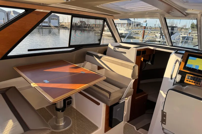 Slide: The Image of Interior of 2025 Cutwater C-288 Coupe boat with seating and navigation system. - 20