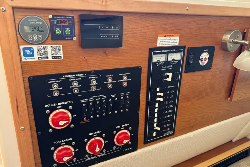 Slide: The Image of Control panel of 2025 Cutwater C-288 Coupe boat with various switches and gauges. - 22