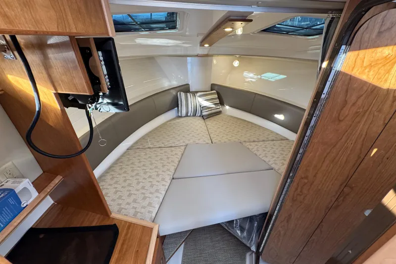Slide: The Image of 2025 Cutwater C-288 Coupe interior cabin with cozy seating and modern design. - 23