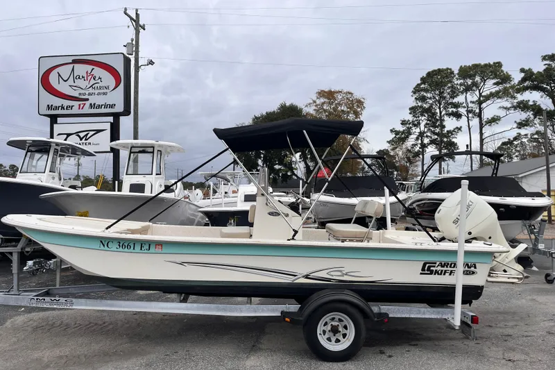 Slide: The Image of 2019 Carolina Skiff 20 JVX CC boat on trailer at Marker 17 Marine dealership. - 1