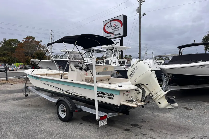 Slide: The Image of 2019 Carolina Skiff 20 JVX CC boat on trailer at dealership. - 2