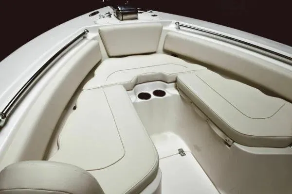 Slide: The Image of 2026 Key West 239 FS boat interior with cushioned seating and cup holders. - 2