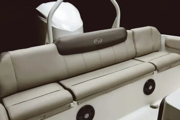 Slide: The Image of 2026 Key West 239 FS boat interior with cushioned seating and built-in speakers. - 4