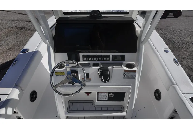 Slide: The Image of Steering console of a Sea Fox boat with modern controls and display. - 12