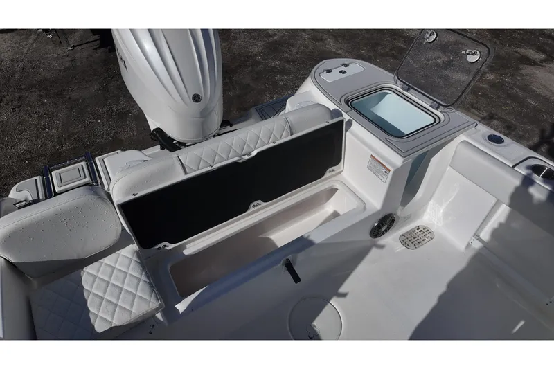 Slide: The Image of Sea Fox boat interior with storage compartments and seating, featuring a white and gray color scheme. - 14